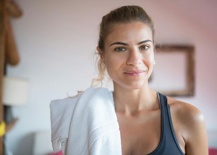 Smiling person enjoying fresh air after a light workout